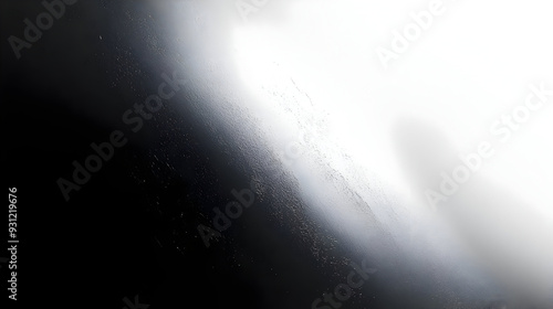 Abstract image depicting a gradient of light and shadow.