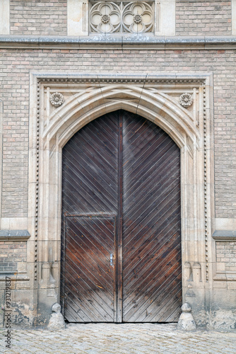 Antique Wooden Door on Medieval Building Facade photo