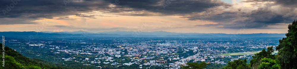 Fototapeta premium The Aerial Panorama View of Chiang Mai City at evening in cloudy day, Thailand