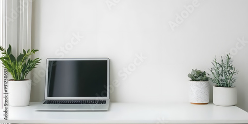 Sleek modern laptop on clean white desk