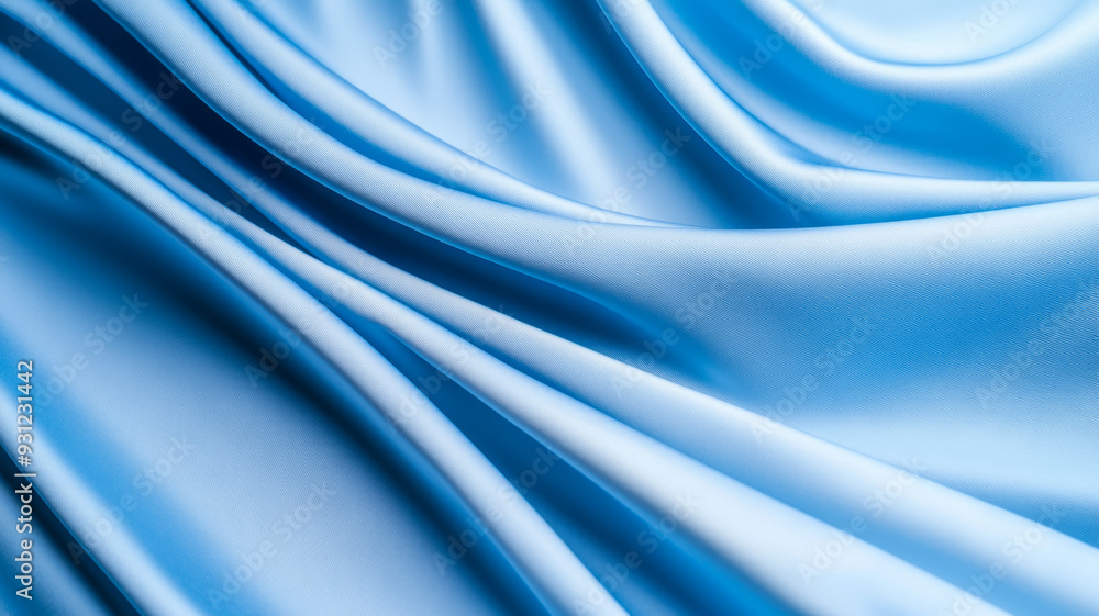 Obraz premium Light blue and white fabric flowing in smooth waves ideal for World Mental Health Day serene and peaceful abstract background promoting calmness and well being 