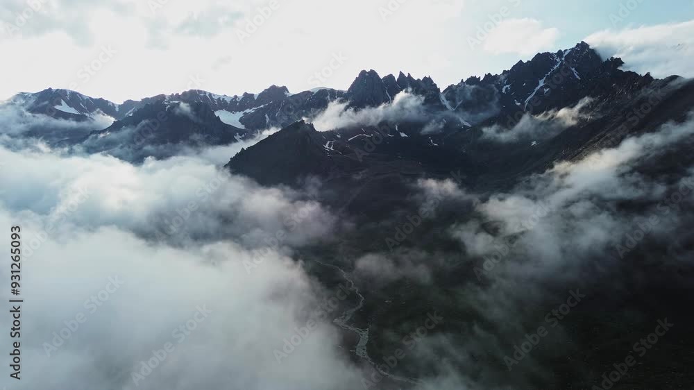 Clouds moving over rocky mountains in Kazakhstan Clouds moving over rocky mountains in Kazakhstan