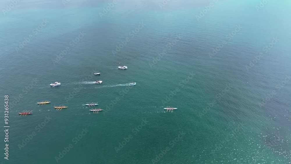 Aerial panning shot showing a rowing boat leading the race in a regatta in Newquay Aerial panning shot showing a rowing boat leading the race in a regatta in Newquay
