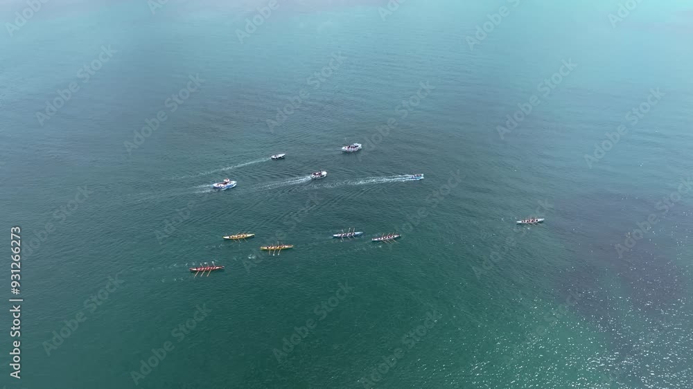 Aerial shot of multiple racing rowing boats competing for a championship Aerial shot of multiple racing rowing boats competing for a championship