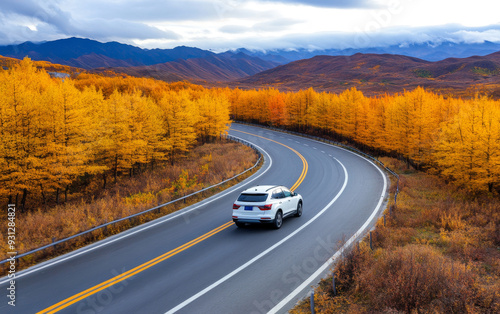 A white SUV car driving on the highway road