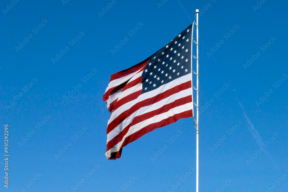 Obraz premium USA Stars and Stripes Flag and blue sky