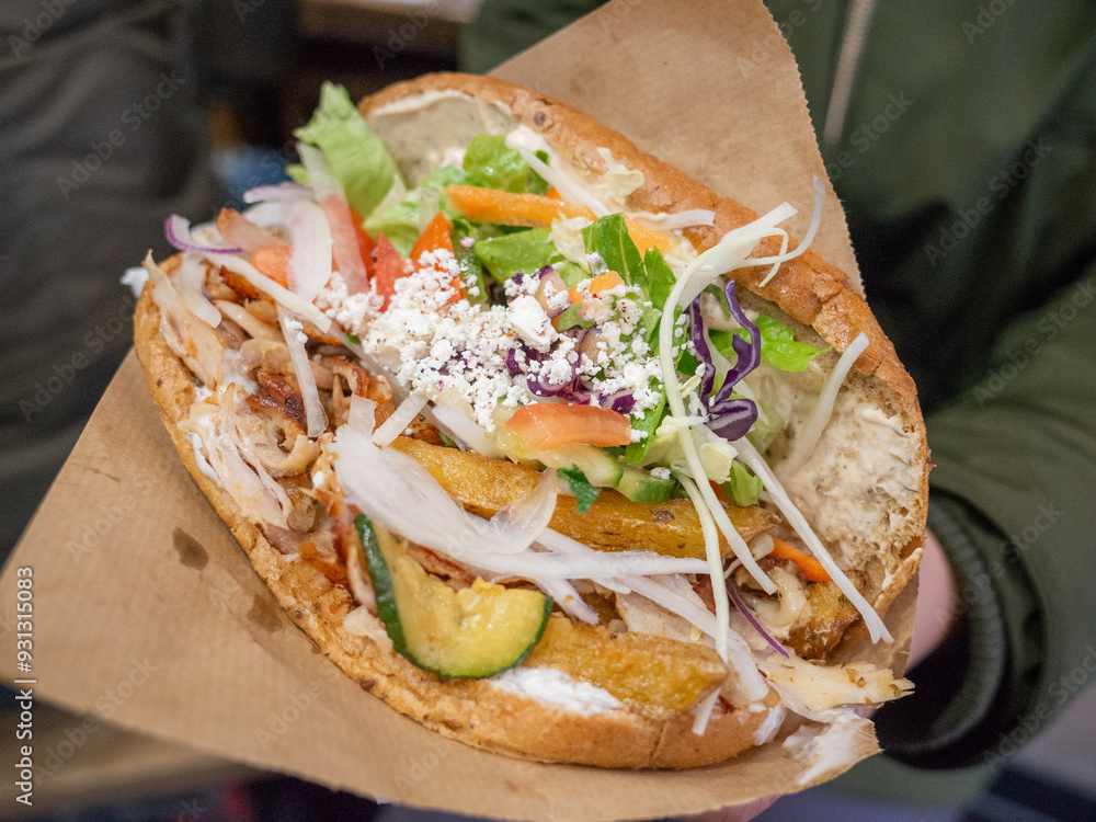 Ταπετσαρία a big kebab sandwich with a lot of meat and vegetables in berlin