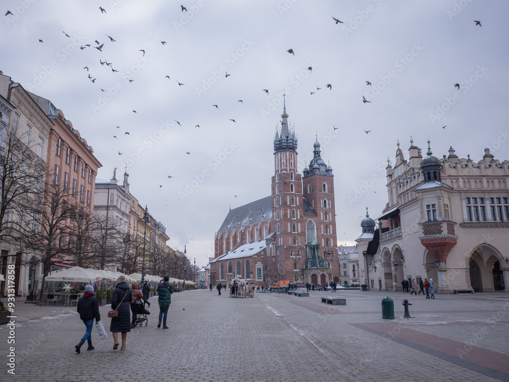 Obraz premium main market square of krakow old city under cloudy sky