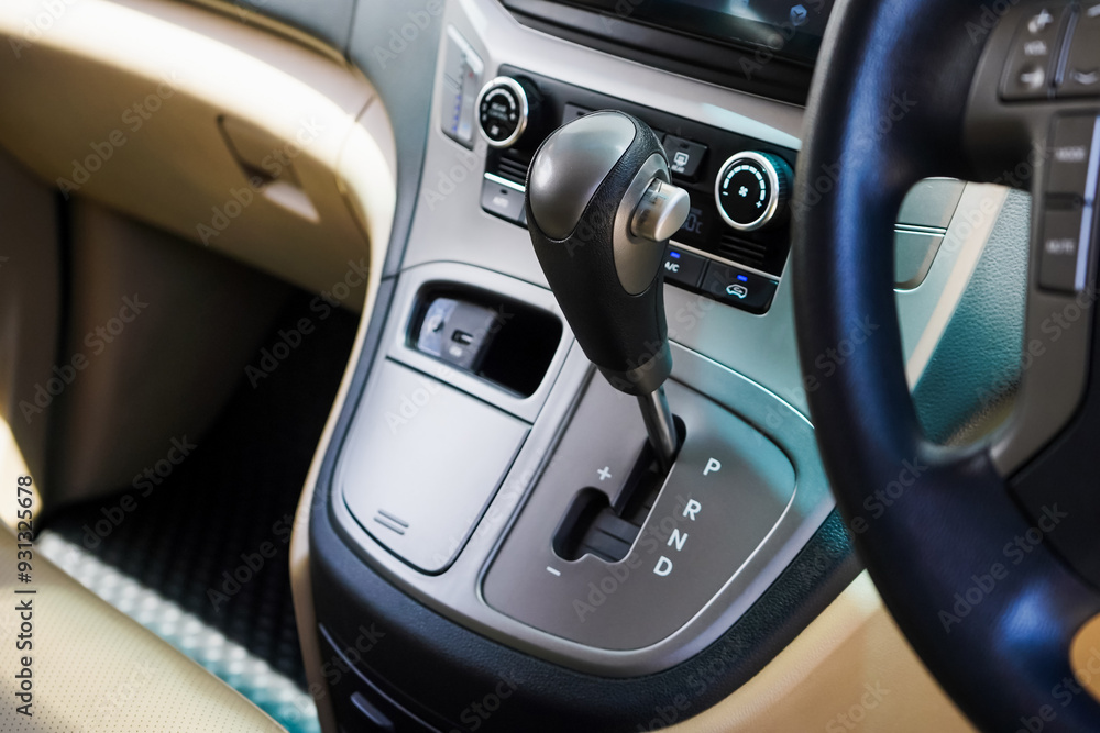 automatic transmission shift selector in the car interior. Closeup a manual shift of modern car gear shifter. 4x4 gear shift automatic transmission shift selector in the car interior. Closeup a manual shift of modern car gear shifter. 4x4 gear shift