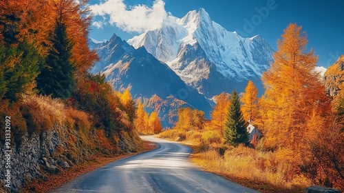 The road to the skiing village of Courmayeur in the Italian Alps during autumn on a sunny day, with vibrant fall foliage and a stunning view of Mont Blanc in the background.