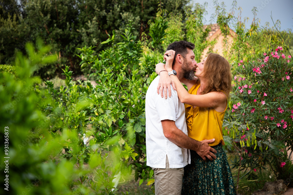happy couple in exotic green garden happy couple in exotic green garden