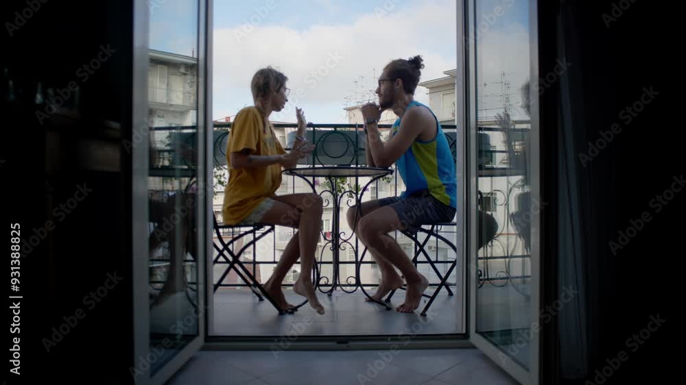 Young couple talking in a balcony in napoli italy Young couple talking in a balcony in napoli italy