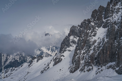 Clouds over snowy mountain peaks, beautiful landscape