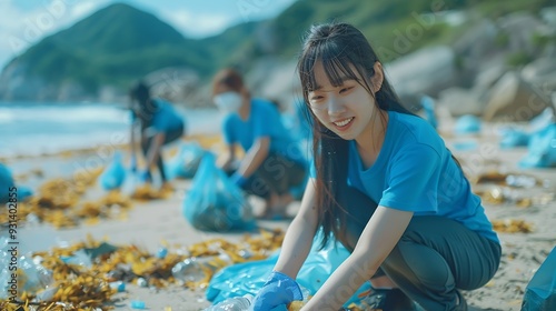 Plastic pollution and environmental problem concept Happy asian diverse group of volunteers with garbage bags wearing blue tshirt and cleaning plastic on the beach Volunteers collectin : Generative AI photo