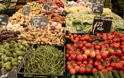 Fototapeta Naklejka Na Ścianę i Meble -  Tomatoes; ginger, beans and other vegetables at the market in Rotterdam. Healthy food, market stall, raw food.