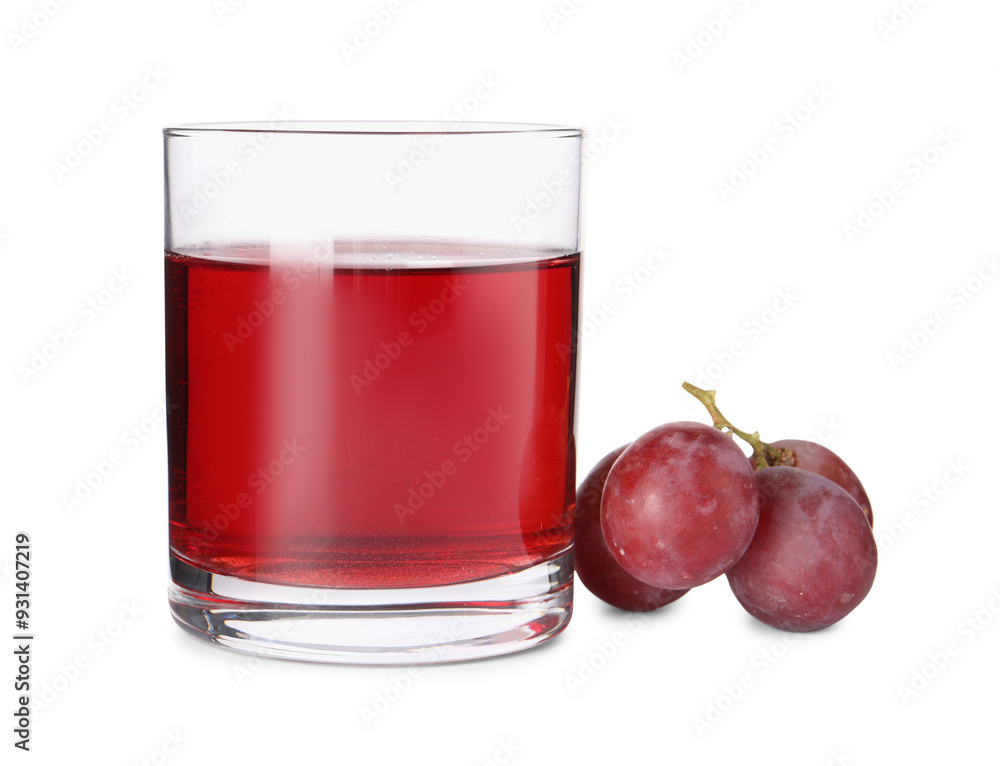 Tasty juice in glass and fresh grapes isolated on white Tasty juice in glass and fresh grapes isolated on white