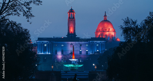 New Delhi, Delhi, India. Kartavya Path, Rajpath Area. Rashtrapati Bhavan - fountain, Bell tower, Central dome of Secretariat Building in evening night illumination lights lighting. City Central Park