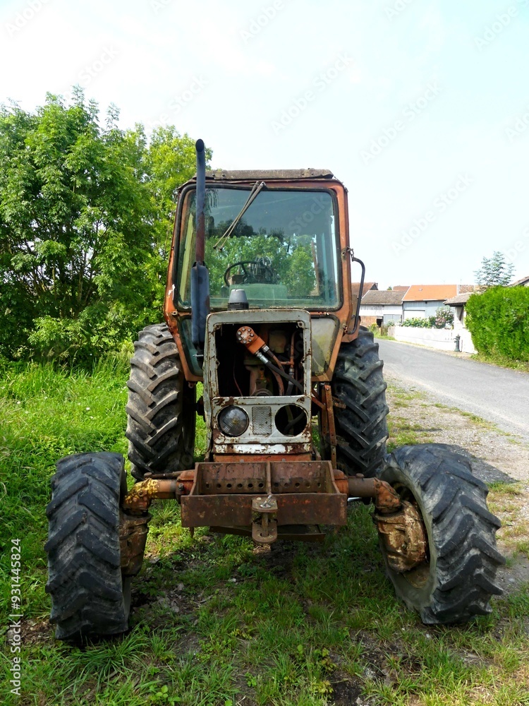 Hiking in the Argonne forest in France - View of a ruined tractor Hiking in the Argonne forest in France - View of a ruined tractor