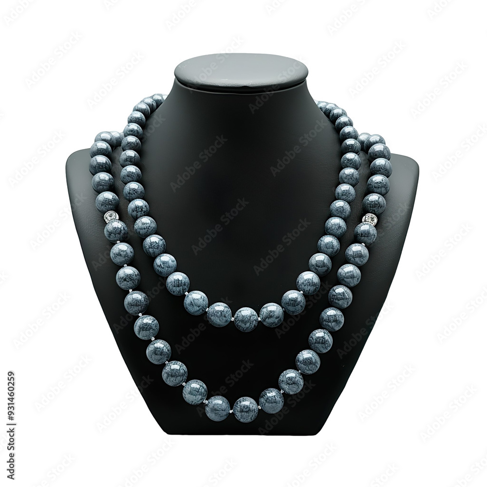 Front view of a sodalite bead necklace with gold-plated spacer beads on a black bust isolated on a white transparent background. Front view of a sodalite bead necklace with gold-plated spacer beads on a black bust isolated on a white transparent background.
