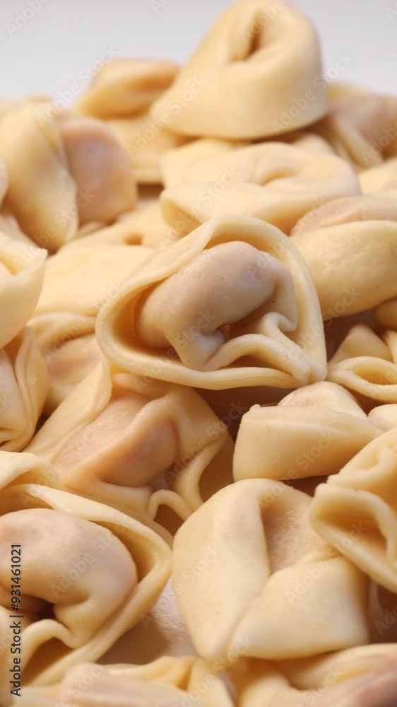 ravioli tortellini stuffed with tomato sauce, rotation in circle. fresh pasta, Turning. Typical Italian dish, vertical video ravioli tortellini stuffed with tomato sauce, rotation in circle. fresh pasta, Turning. Typical Italian dish, vertical video