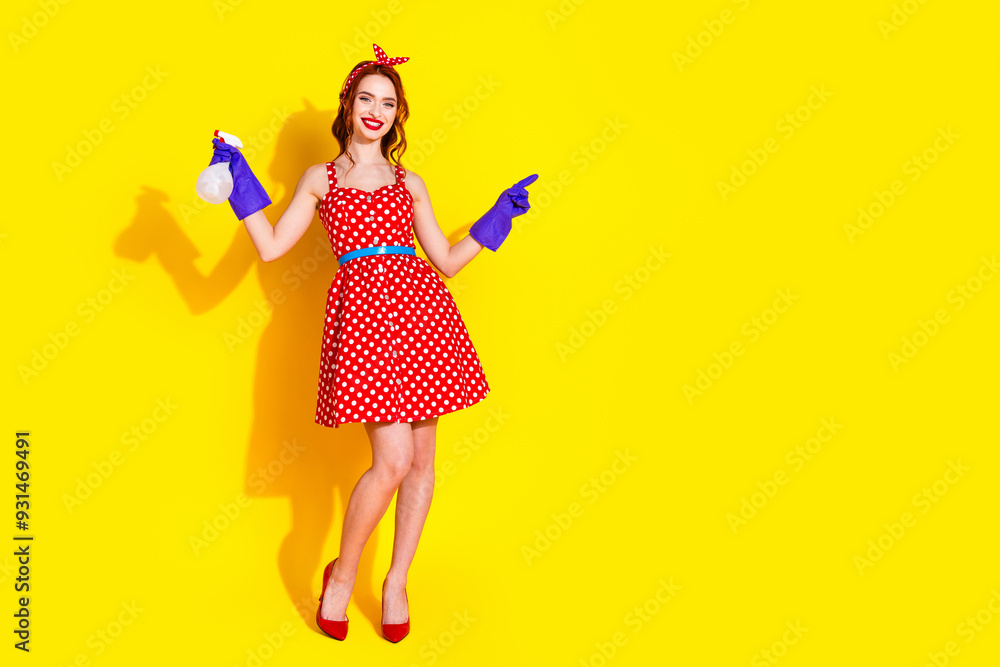 Photo of cheerful adorable pretty lady wear red dress hold bottle empty space isolated on yellow color background Photo of cheerful adorable pretty lady wear red dress hold bottle empty space isolated on yellow color background