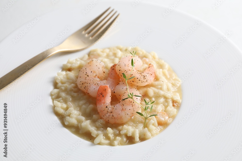 Delicious risotto with shrimps and cheese on plate, closeup Delicious risotto with shrimps and cheese on plate, closeup
