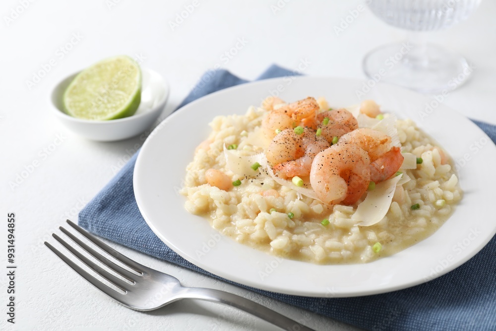 Delicious risotto with shrimps and cheese on white table, closeup Delicious risotto with shrimps and cheese on white table, closeup