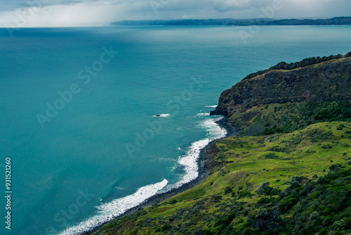 Panoramic view over Te Toto Gorge and Tasman Sea on an overcast summer day. High vantage point. Raglan, New Zealand