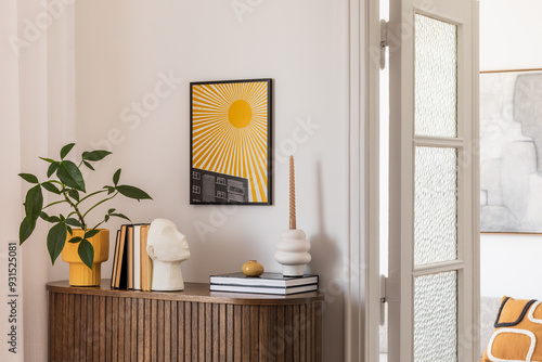 Stylish interior with a wooden cabinet adorned with potted plants, decorative objects, and books. A vibrant art piece featuring a sunburst design adds a pop of color. Cozy seating area. Template.
