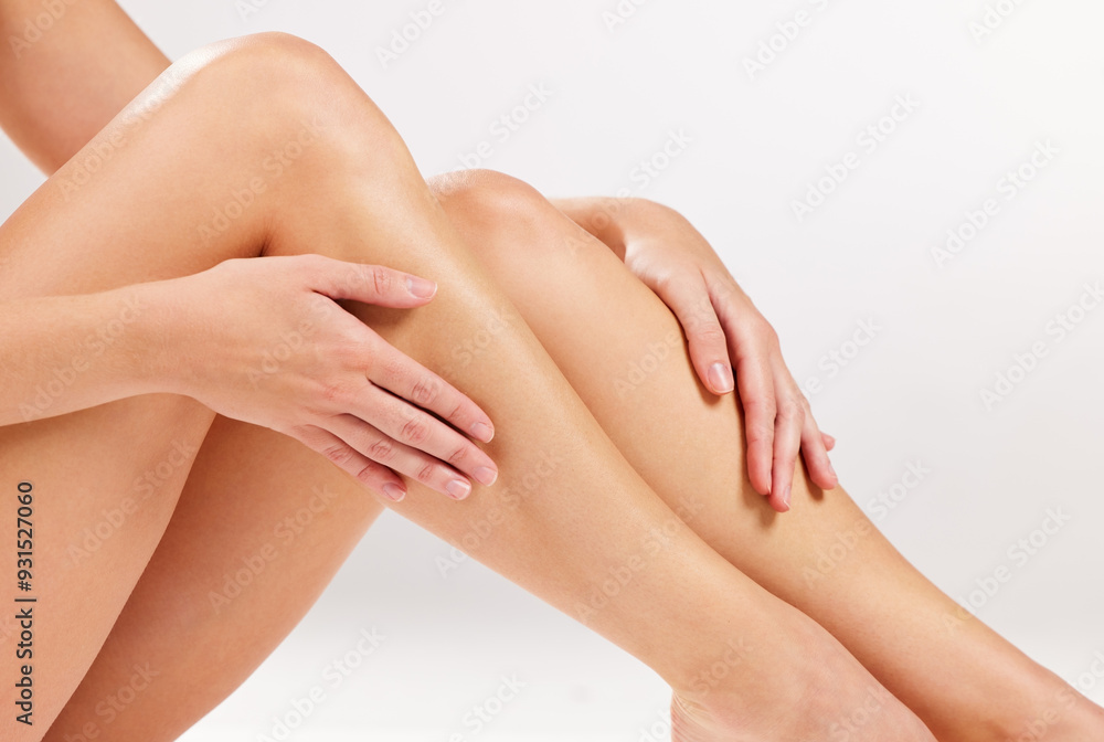 Skincare, studio and legs of woman with hands for cosmetic self care, treatment and spa results. Body, dermatology and person with shine for hair removal, texture and epilation on white background Skincare, studio and legs of woman with hands for cosmetic self care, treatment and spa results. Body, dermatology and person with shine for hair removal, texture and epilation on white background