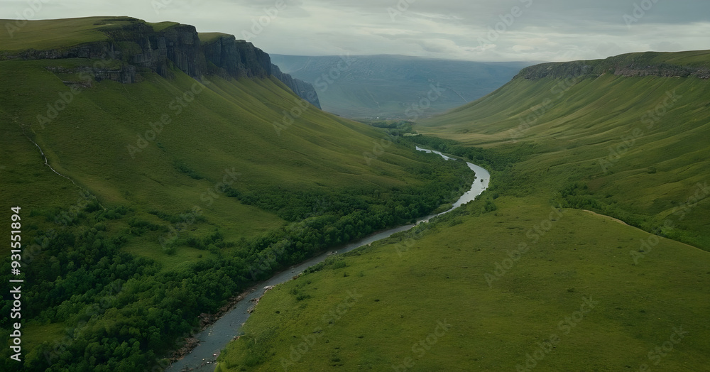 Fototapeta premium River flowing through lush green valley surrounded by cliffs