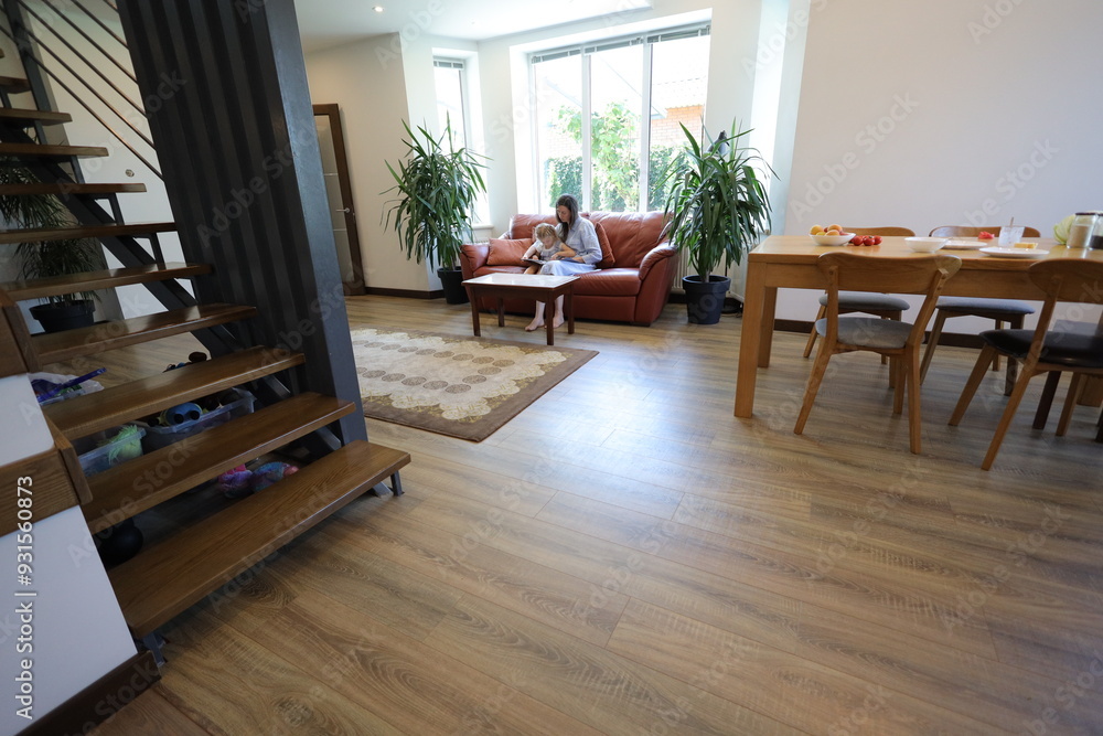 Fototapeta premium Mother and a child reading at home