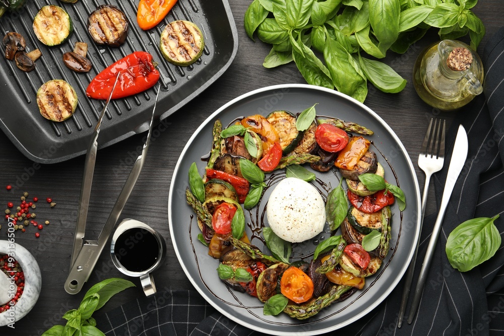 Tasty salad with grilled vegetables and mozzarella cheese served on black wooden table, flat lay Tasty salad with grilled vegetables and mozzarella cheese served on black wooden table, flat lay