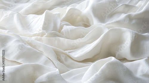 Macro photograph of crumpled white fabric, capturing the fine details of the wrinkles and folds with soft lighting to create a soothing and elegant background.