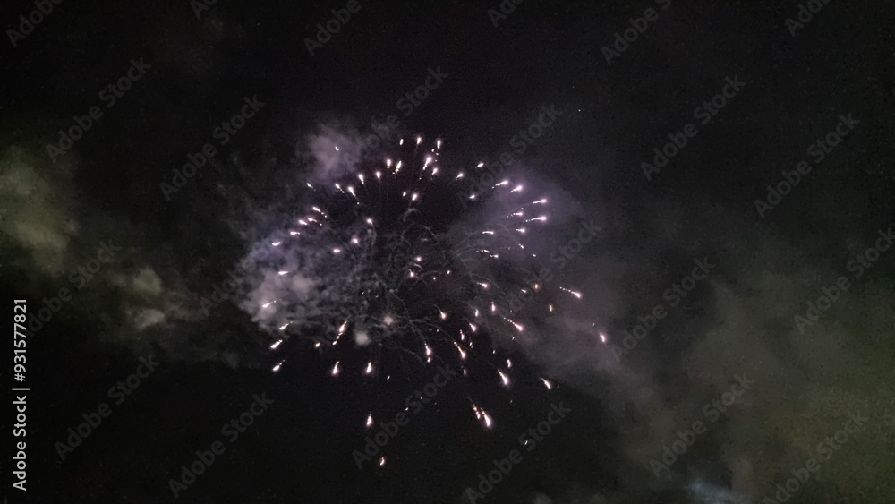Fototapeta premium fireworks explosions in the night space for your text background