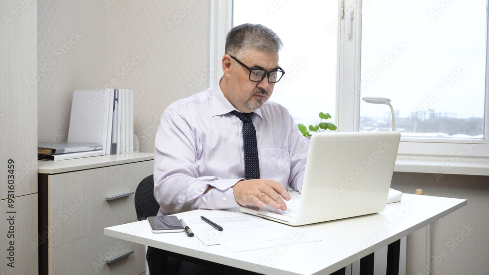 Businessman Working on Computer in Office Businessman Working on Computer in Office