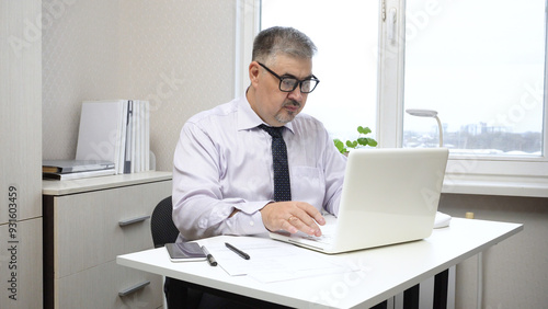 Businessman Working on Computer in Office