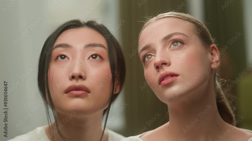Two beautiful healthy diversity multiracial girls multiethnic females women Asian Chinese Japanese Korean woman girl Caucasian lady female portrait holding flowers near faces cosmetic skin care beauty Two beautiful healthy diversity multiracial girls multiethnic females women Asian Chinese Japanese Korean woman girl Caucasian lady female portrait holding flowers near faces cosmetic skin care beauty