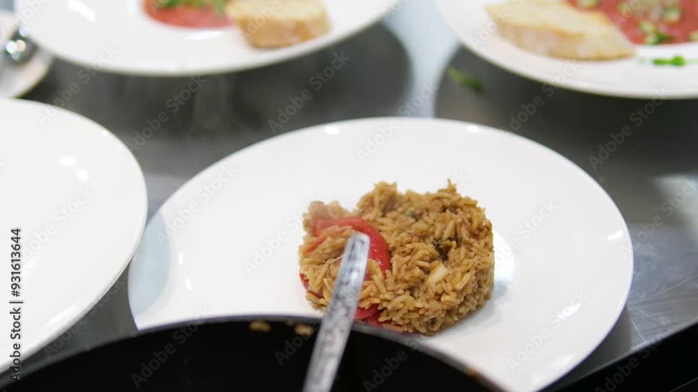 Indonesian yellow rice served with tofu, egg, vermicelli and orek tempe. rice serving dish Indonesian yellow rice served with tofu, egg, vermicelli and orek tempe. rice serving dish