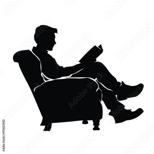 Silhouette of a man sitting in a chair and reading a book.