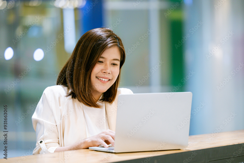Asian woman working with laptop in coffee shop, business financial concept. Asian woman working with laptop in coffee shop, business financial concept.