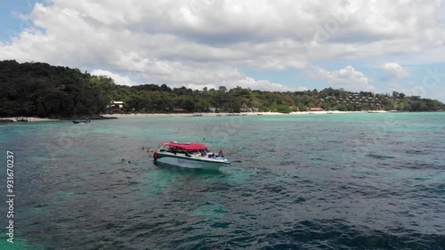 Moored speed boat, tourists, snorkeling spot, coral reef, coastline, turquoise. Sunny weather, island tour, Phi Phi, Maya Bay, beautiful nature of Thailand, mountain landscape, underwater world. High