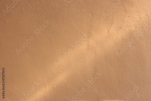 Soil wall texture of clay house structure with sunlight. Mud background