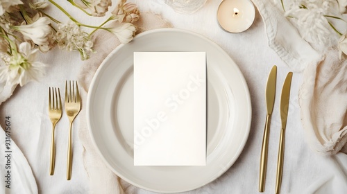 Elegant wedding table setting with a blank place card on a white plate. Perfect mockup for wedding invitations, event branding, or menu design in an upscale, refined atmosphere