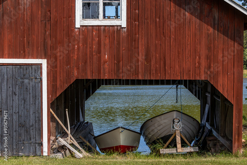 Oregrund, Sweden A red boat house with rowboats. photo