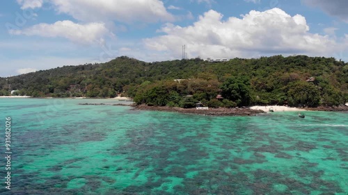 Phi Phi, snorkeling spot, tour, turquoise water, corals, islands, boats, sky. Aerial photography, clear water, active holiday in Thailand, tropical climate. High quality 4k footage