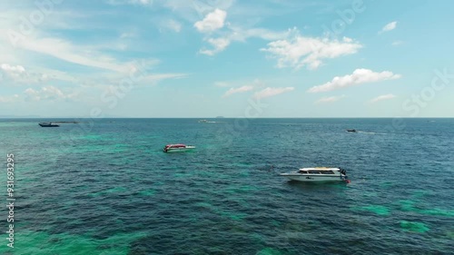 Boats, seascape, turquoise water, Phi Phi Islands tour, aerial view, sky, waves. Coral reef, calm sea, speed boats, tourism, sunny day, Phi Phi, Maya Bay, snorkeling. High quality 4k footage
