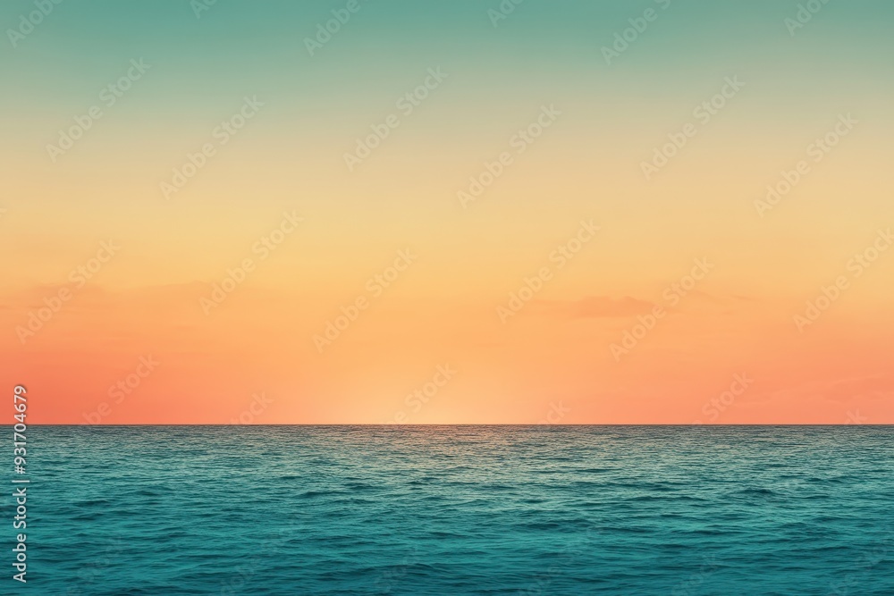 Obraz premium A gradient moving from a warm orange to a cool teal with a subtle grain effect, resembling a sunset over the ocean.
