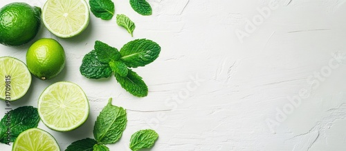Sliced and whole limes alon...