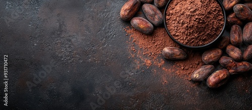 Raw cocoa beans on a dark s...